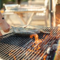 PP - Roo Cooking Fish on Plain Jane 120 with 1 Swing Arm and BBQ Rack Close Up - Lifestyle - Firepits UK - 600x600343