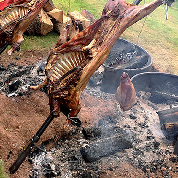 Asado Cooking Rack Fire Pit Close Up Lifestyle - FirepitsUK - WEB - Lo Res