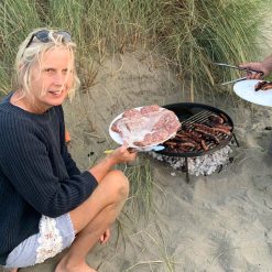 Beach BBQ Fire Pit Lit with Burgers and Sausages Lifestyle - Firepits UK - WEB - Lo Res