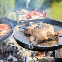 Plain Jane 90 with 3 Swing Arm BBQ Racks Fire Pit close up of chicken Lifestyle - Firepits UK - WEB - Lo Res