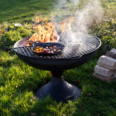 Wine Glass Fire Pit Lit with Half Moon BBQ Rack and Skillet Pan with Peppers and Pigs in Blankets from Afar Lifestyle - Firepits UK - WEB - Lo Res