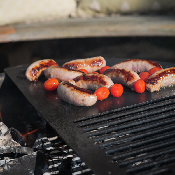 VPit Fire Pit Lit on Patio with Sausages on BBQ Plate Lifestyle - Firepits UK - LoRes 4