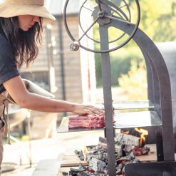 Double Katherine Wheel - Lifestyle with Pom Pom cooking steak - Firepits UK - WEB 600x600 - Lo Res2