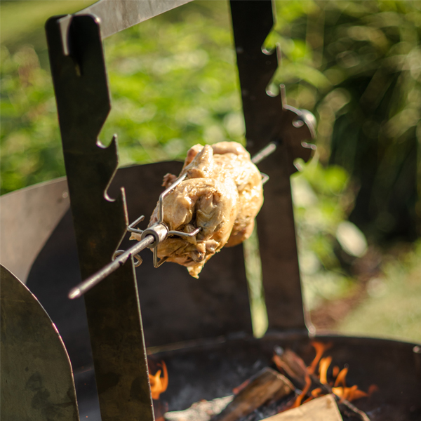 PP - Plain Jane Fire Pit with Wind Shield and Chicken on Rotisserie Lit - Lifestyle - Firepits UK - WEB 600x600 - Lo Res 286