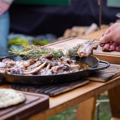 Lamb with rosemary in a pan on a table