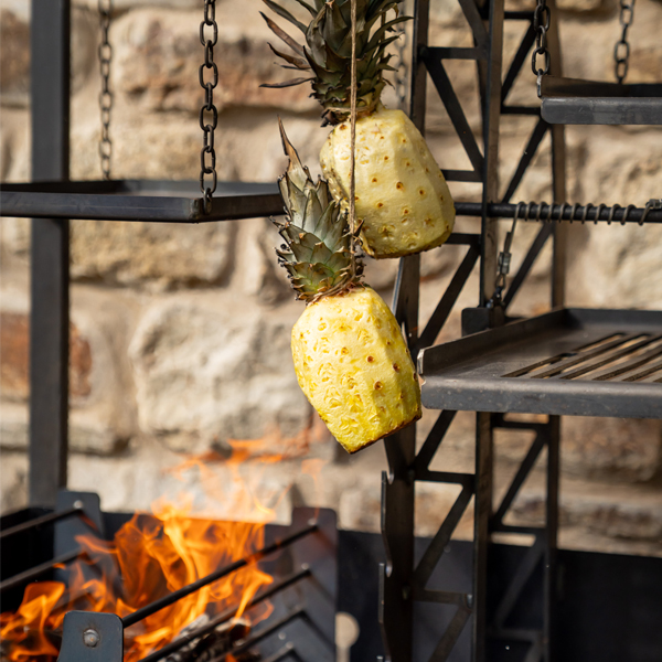 Pineapples hanging on Asado Maximo - Close Up - Firepits UK - Lifestyle - LoRes07535600x600